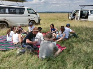 4×4 safari Van travelling across the Masai Mara during a Kenya wildlife tour