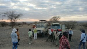 Guests viewing wildlife and sundowners from a customised 4×4 Land Cruiser during a Kenya safari tour
